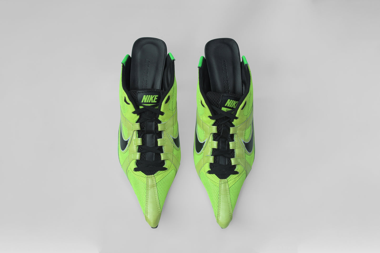 A photograph of the top view of a pair of Ancuta Sarca Olympia Heel Green Shoes, GREEN AND BLACK, FRONT LACE-UP FASTENING, POINTED TOE, SLIP-ON STYLE, MADE IN ITALY