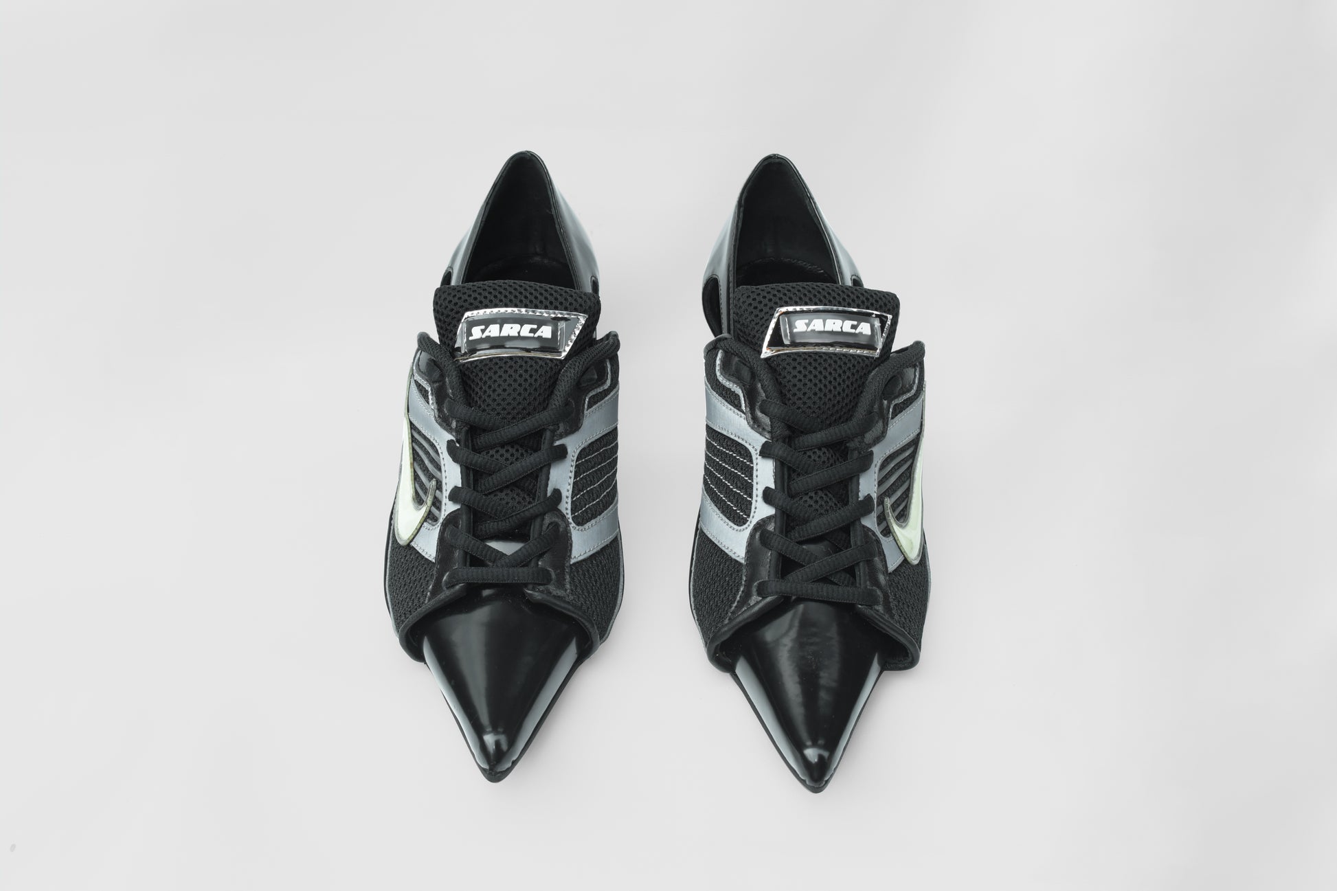 A photograph of the top view of Ancuta Sarca Lamborghini Heel Black shoes, 6CM HEEL, UPCYCLED TRAINER CLOSED BACK PUMPS, POINTY TOE, BLACK FAUX LEATHER