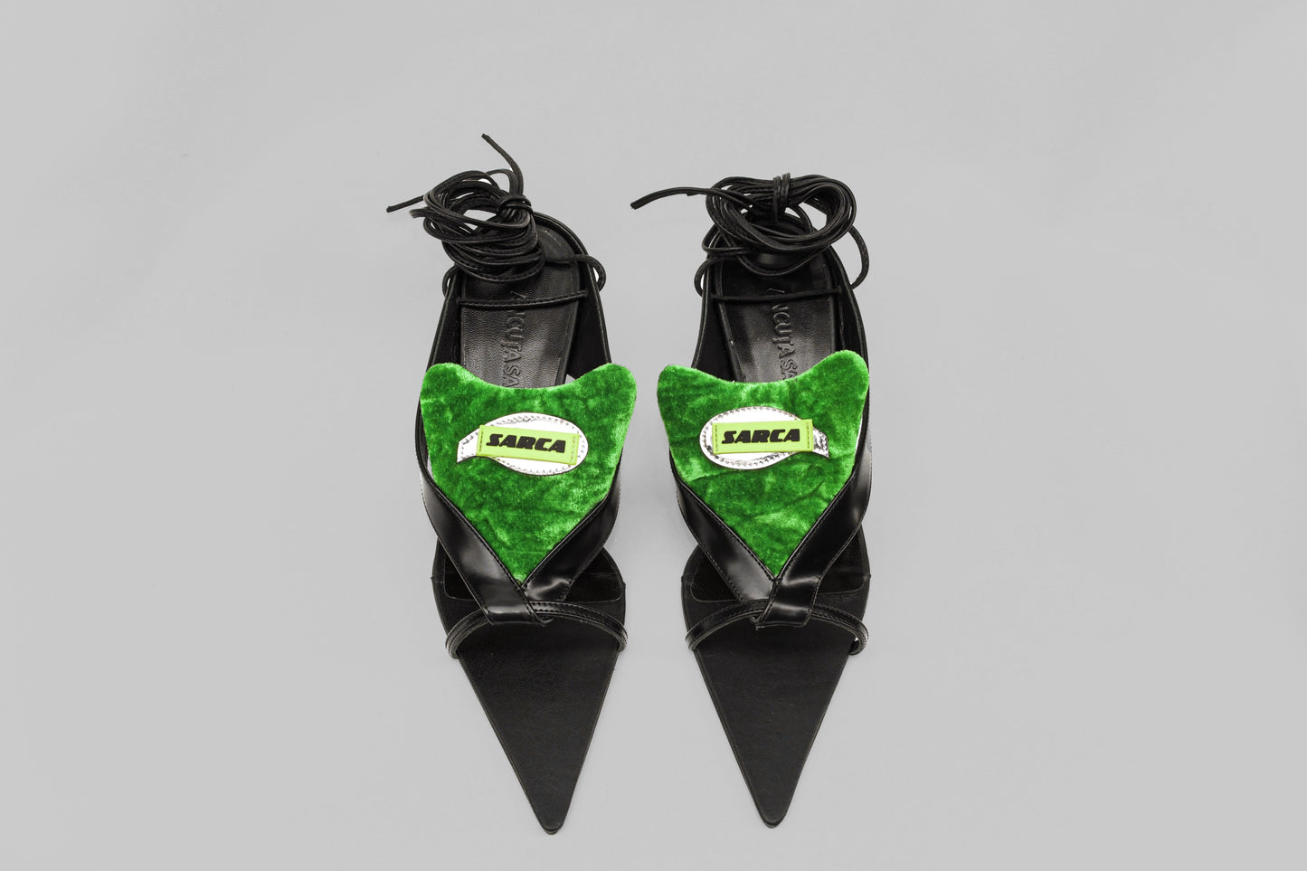 A photograph of the top view of a pair Ancuta Sarca Tallulah Sandal shoes in BLACK AND GREEN, SELF-TIE ANKLE STRAP FASTENING, PADDED LOGO PATCH ON TONGUE, MADE IN ITALY